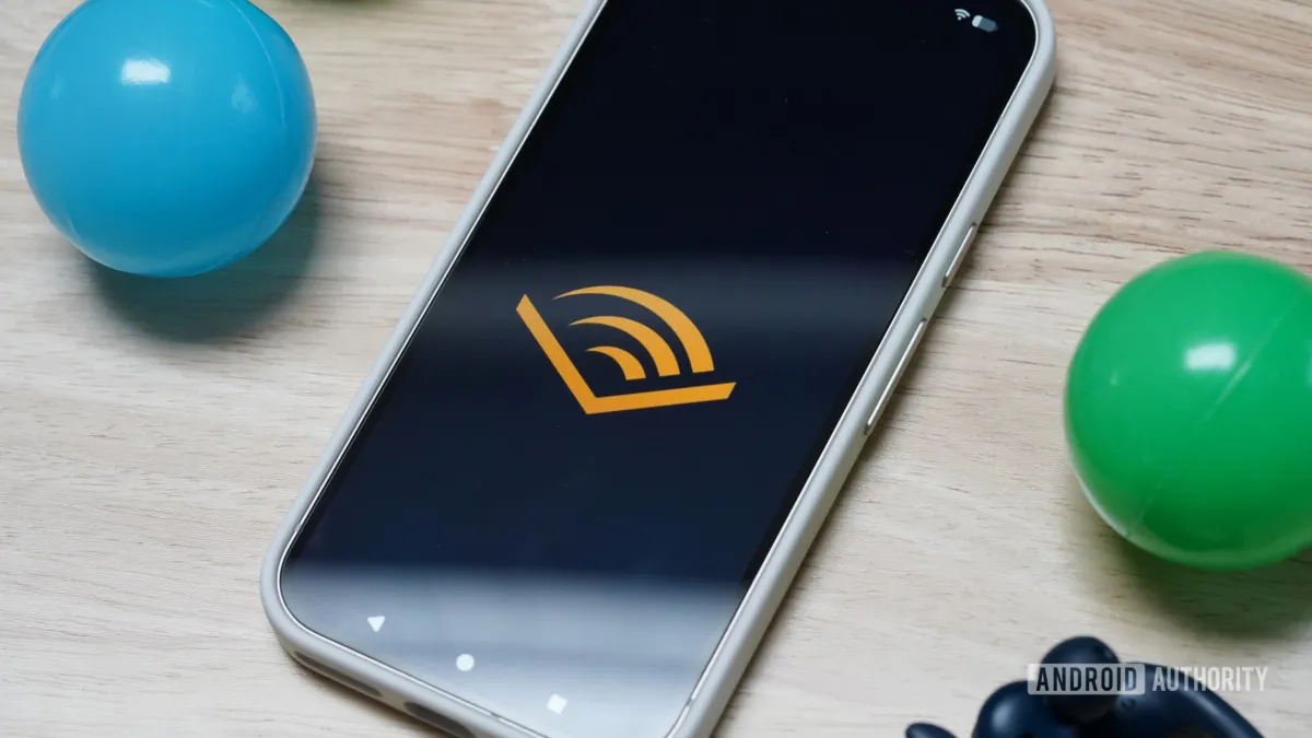 Audible rewards program dashboard displaying gamified listening badges and tier status for members.