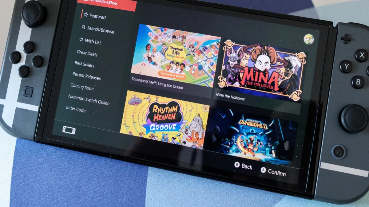 The updated Nintendo Switch eShop interface displays a system-synced dark mode layout and native application design.