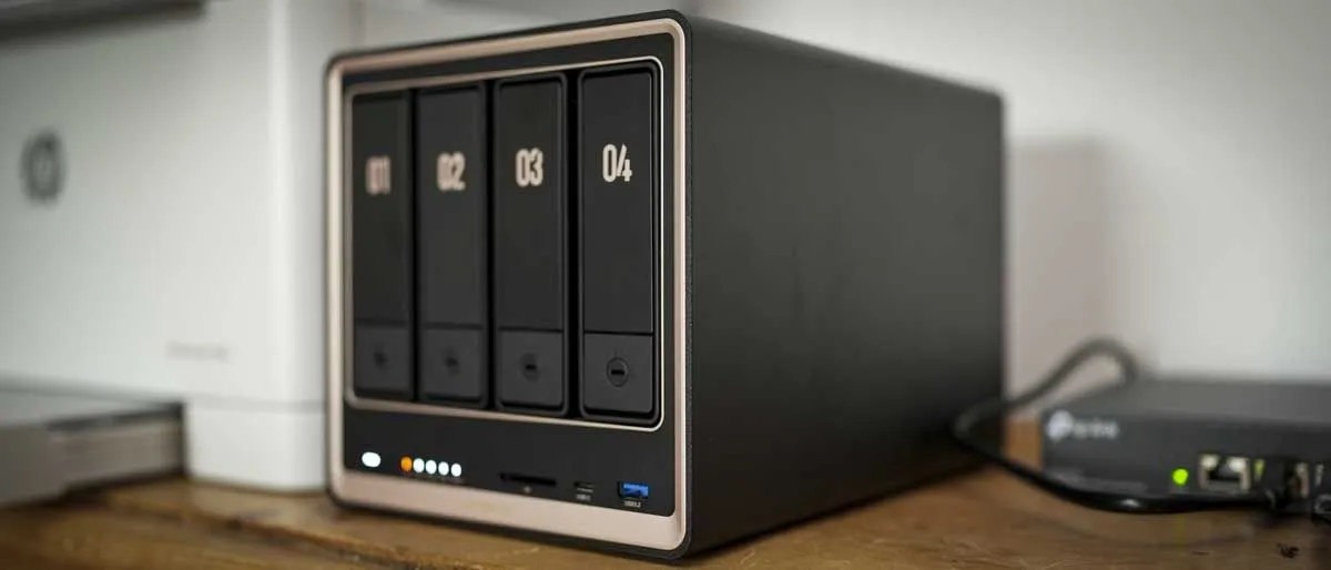 The Ugreen NASync DXP4800 GT four-bay NAS chassis displays front drive slots and rear networking ports.