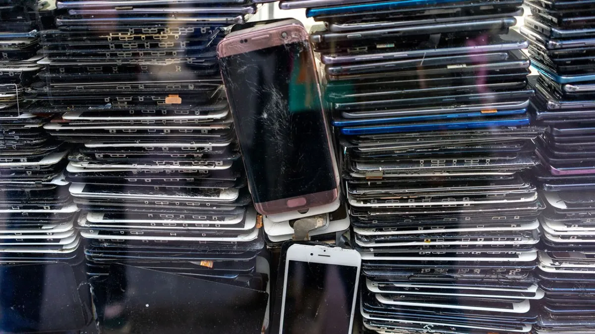 A cluster of repurposed smartphones mounted on a rack for a low-cost computing research project.