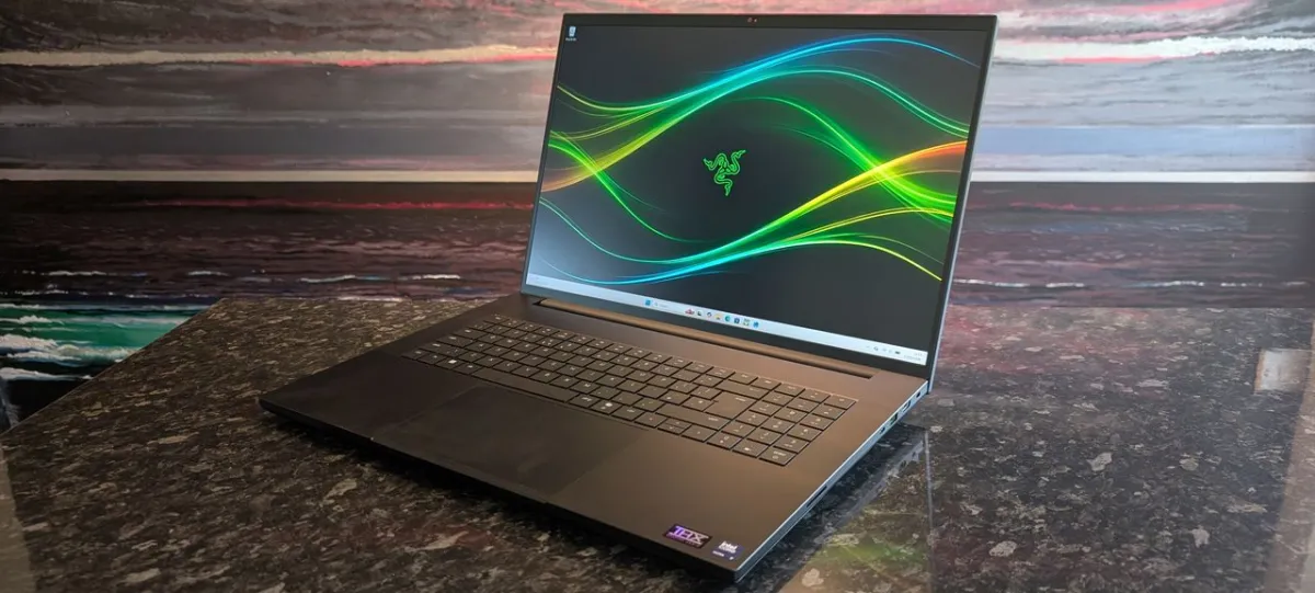 The 2026 Razer Blade 18 laptop is shown with its slim chassis and keyboard visible.