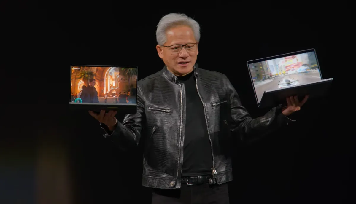 A laptop featuring Nvidia RTX Spark processors sits beside a MacBook Pro during a hardware comparison.