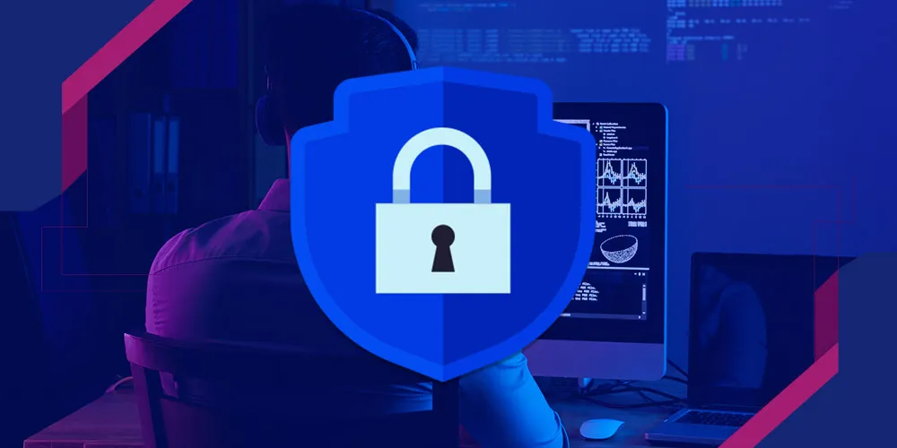 A cybersecurity professional reviews network defense strategies on a computer screen.