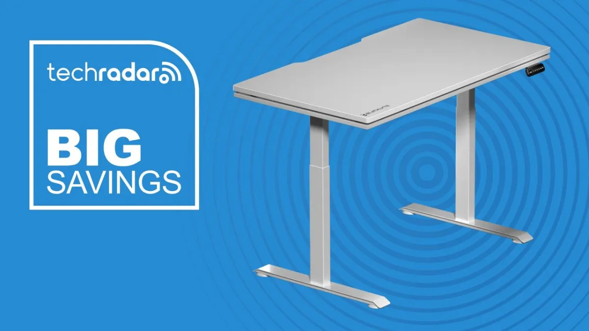 The Blacklyte Atlas Lite standing desk displays its dual motor frame and adjustable height range.