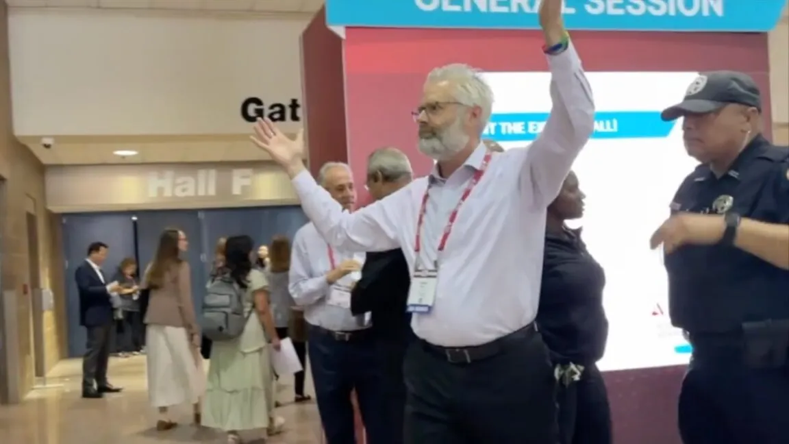 Scientists are escorted from the American Diabetes Association annual meeting in New Orleans.