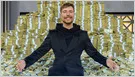 Jimmy Donaldson, known as MrBeast, stands beside a graphic celebrating 500 million YouTube subscribers.