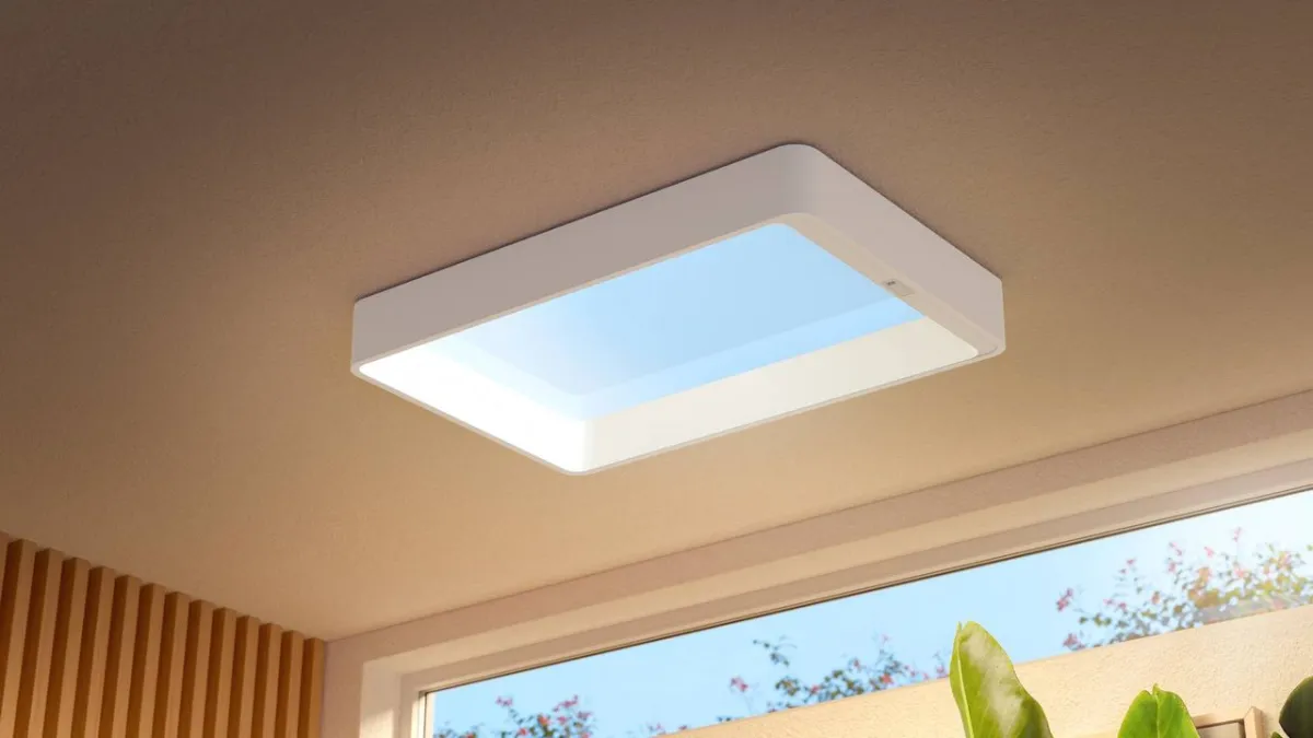 Philips Skylight ceiling fixture simulating natural daylight with a dedicated remote control for circadian health.