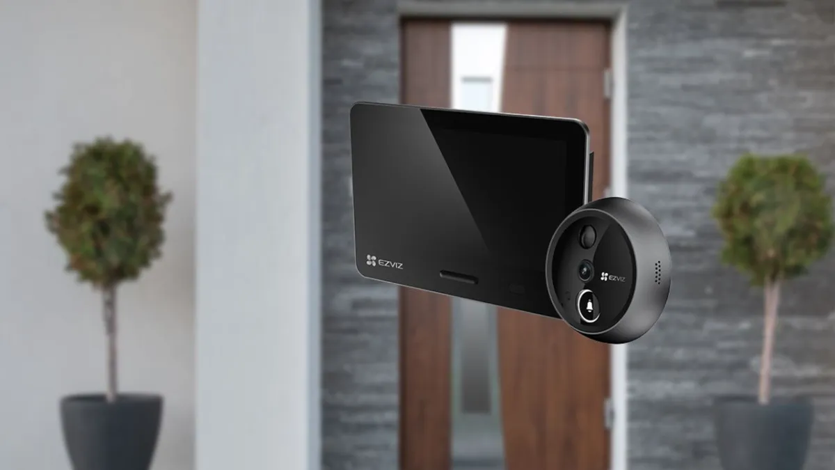 The EZVIZ EP4 peephole camera is mounted on a door with its wireless monitor displaying live footage and settings.
