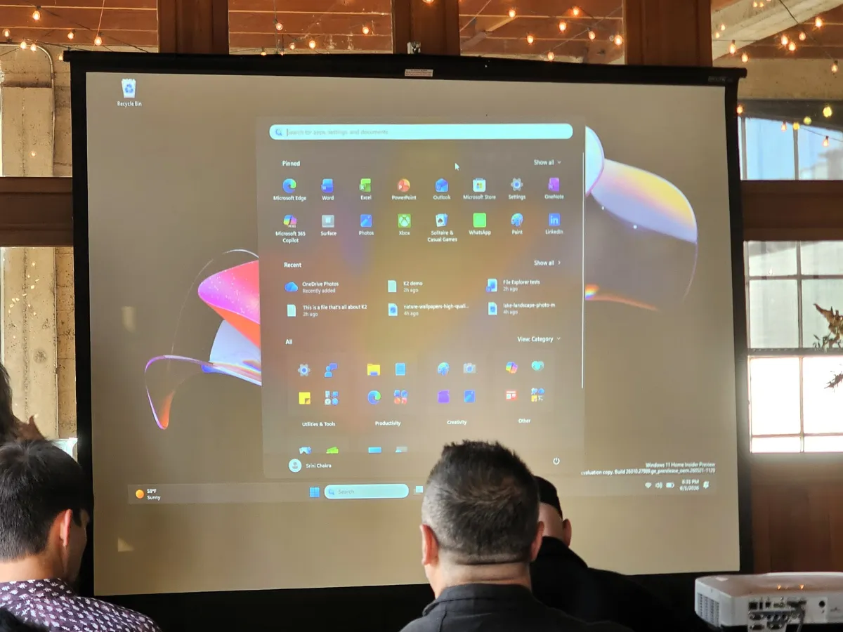 Attendees participate in a Windows Insider feedback session with Microsoft developers.