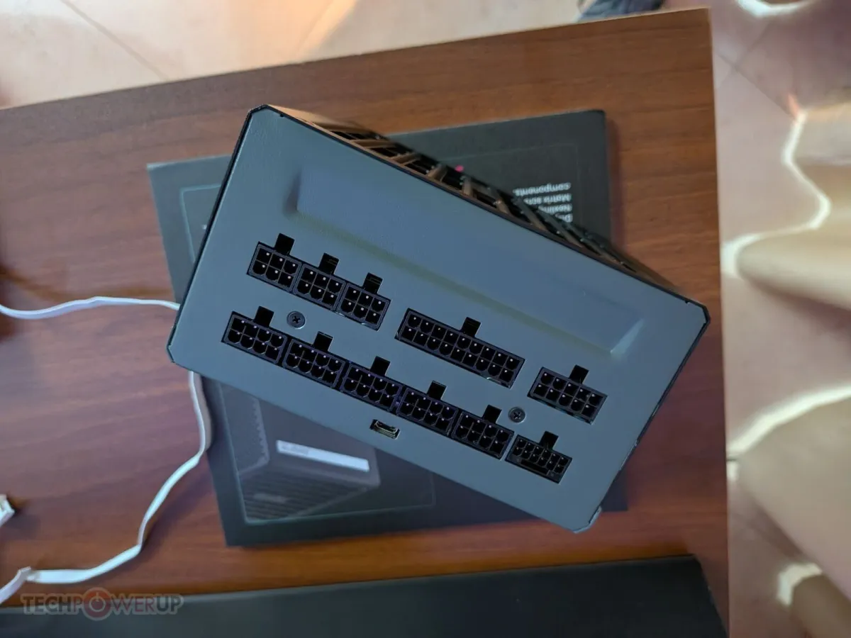 Phanteks EX series computer case and AMP power supply on display at a technology exhibition