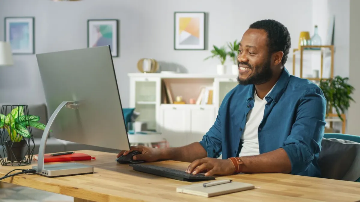 Workers troubleshoot connectivity issues and frozen screens during a hybrid video conference.