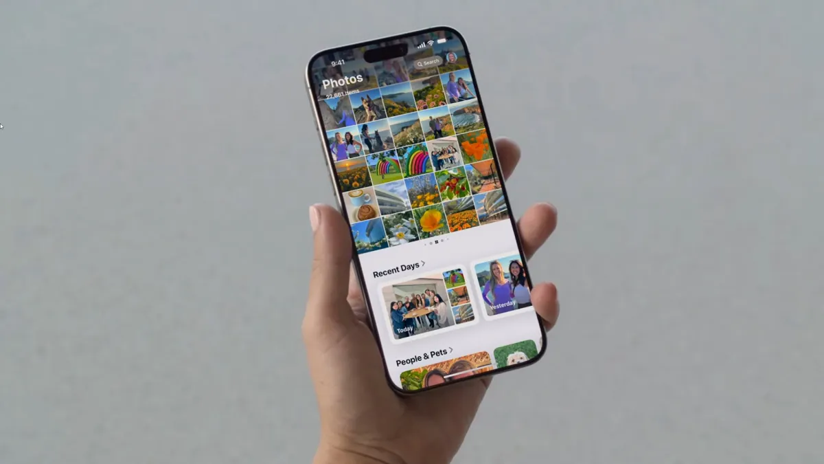 The Apple Photos interface displays the spatial reframing tool for adjusting photo perspective.