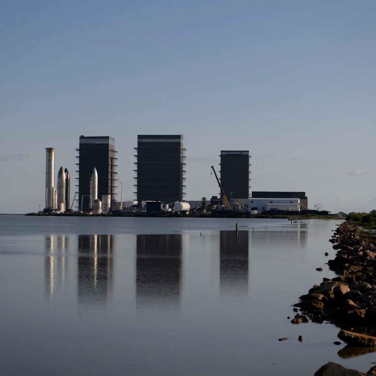 A SpaceX rocket and financial charts illustrate the company's public listing and wealth management sector.
