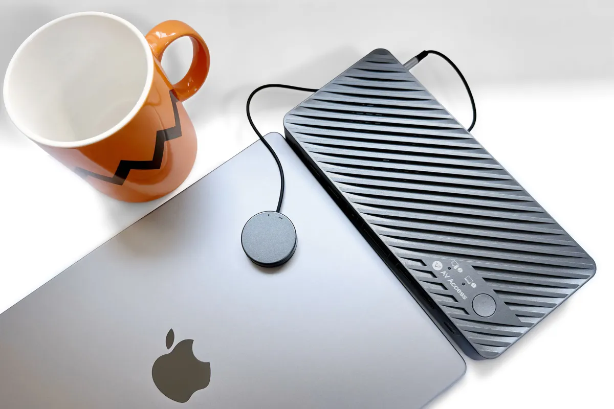 AV Access iDock M10 KVM docking station connected to a MacBook and two external displays