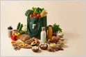 FirstClub grocery delivery startup logo and team are visible in Bengaluru following $55M Series B funding.