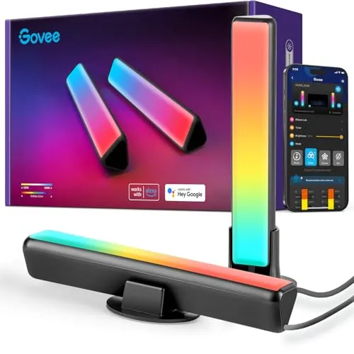 Monitor light bar mounted above a screen, directing asymmetric downward light to reduce glare and illuminate the desk.