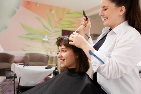 A woman consults a dermatologist about medical hair loss treatments at a specialized clinic.
