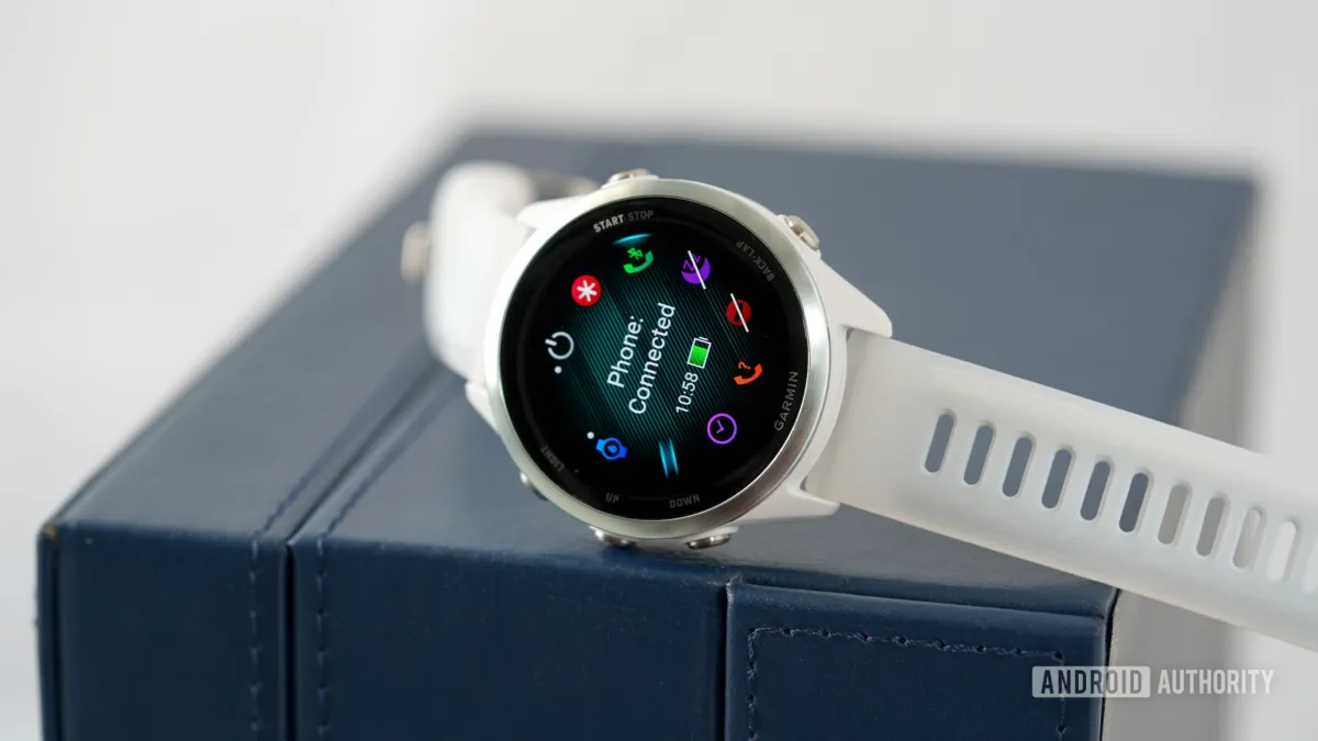 The Garmin Forerunner 570 smartwatch displays training metrics on its AMOLED screen.