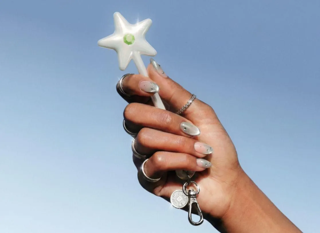 The iridescent star-topped NFC payment wand enables contactless transactions.