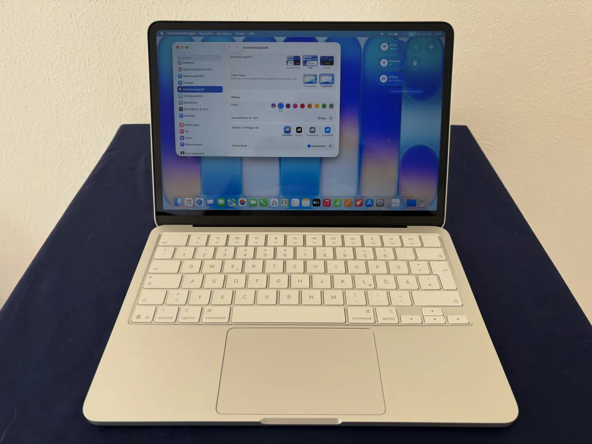 A disassembled MacBook Neo displays mixed color internal components during a self service repair demonstration.