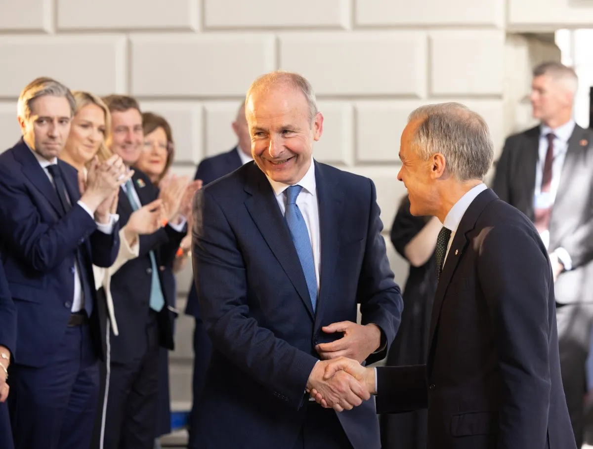 Prime Minister Mark Carney and Taoiseach Micheál Martin signing a joint statement on biomanufacturing partnership