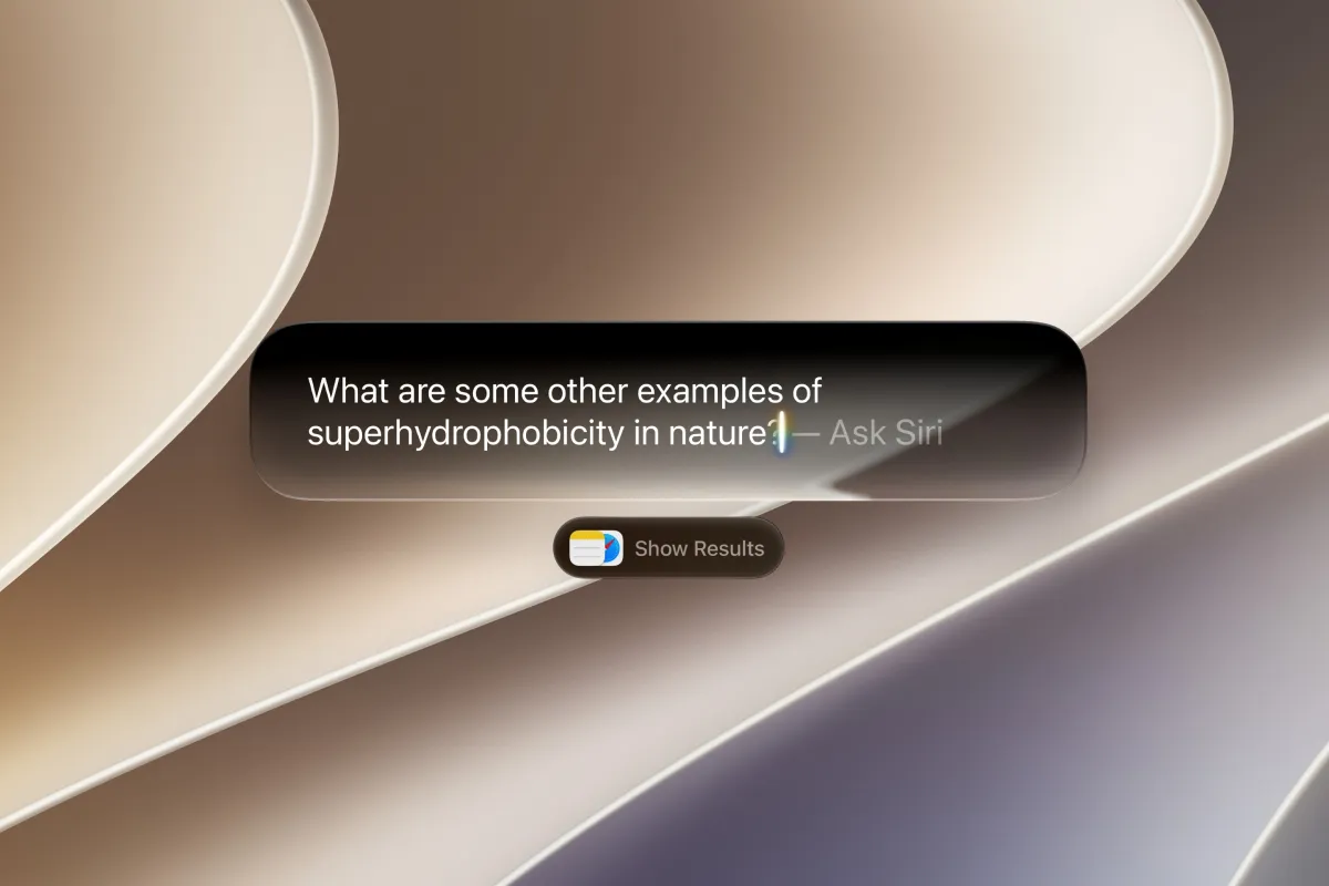 Apple WWDC keynote stage displaying the Liquid Glass interface slider