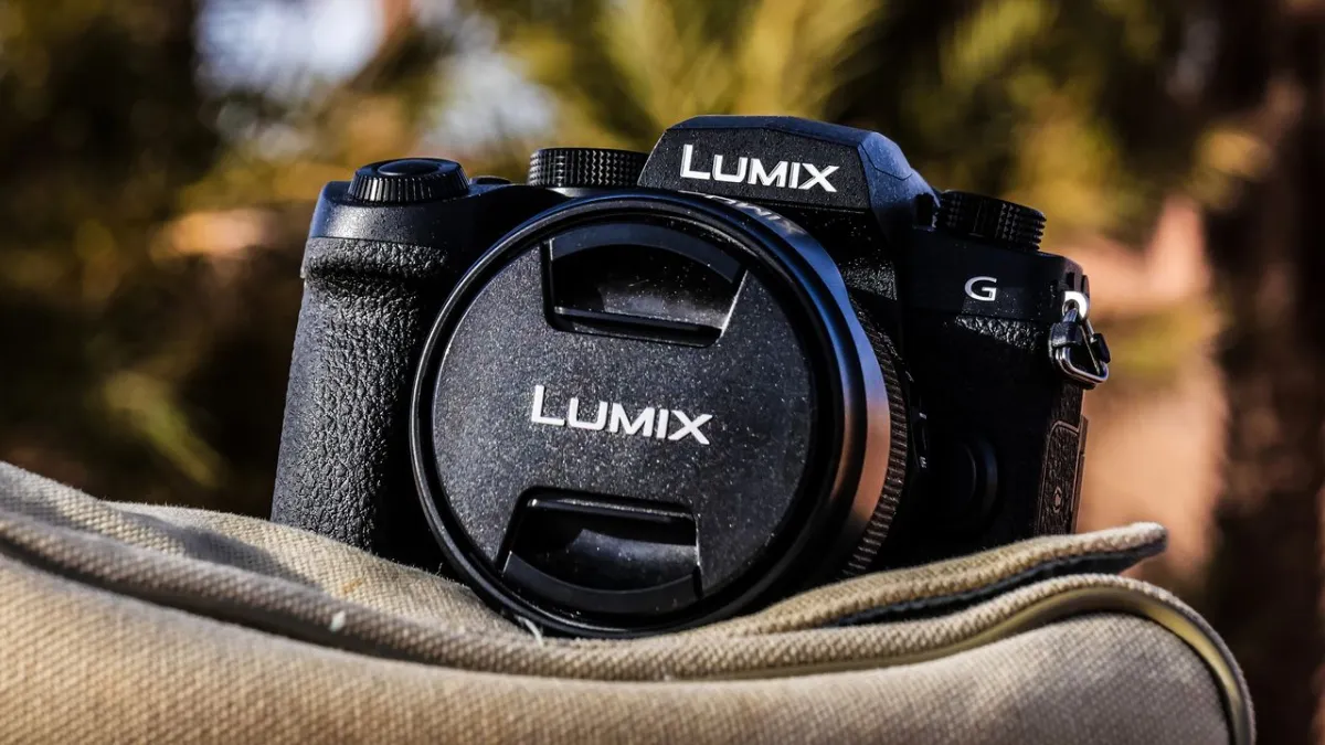 Panasonic Lumix G97 mirrorless camera with attached lens displayed against a neutral backdrop