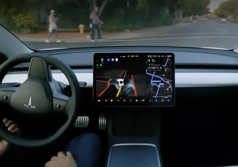 Employees reviewing Tesla driving footage in a data labeling office to train full self driving systems.