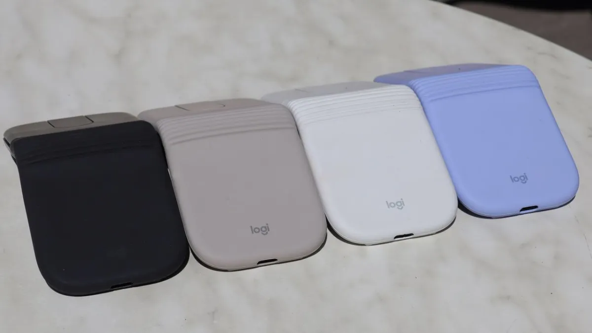 Logitech Mobi Fold mouse shown in a compact folded configuration with a textured rubberized exterior.