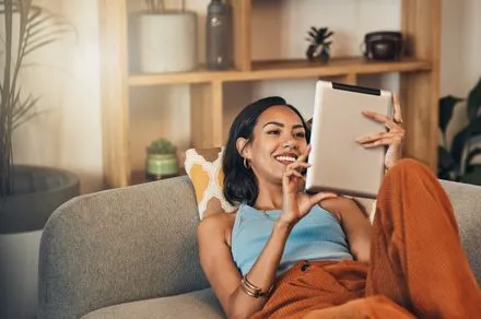 A smartphone displays a mobile application interface for serialized romance and fantasy fiction.