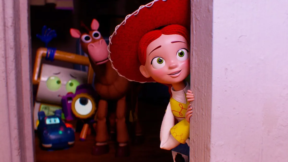 Jessie surrounded by fifty Buzz Lightyear action figures in a quiet room.