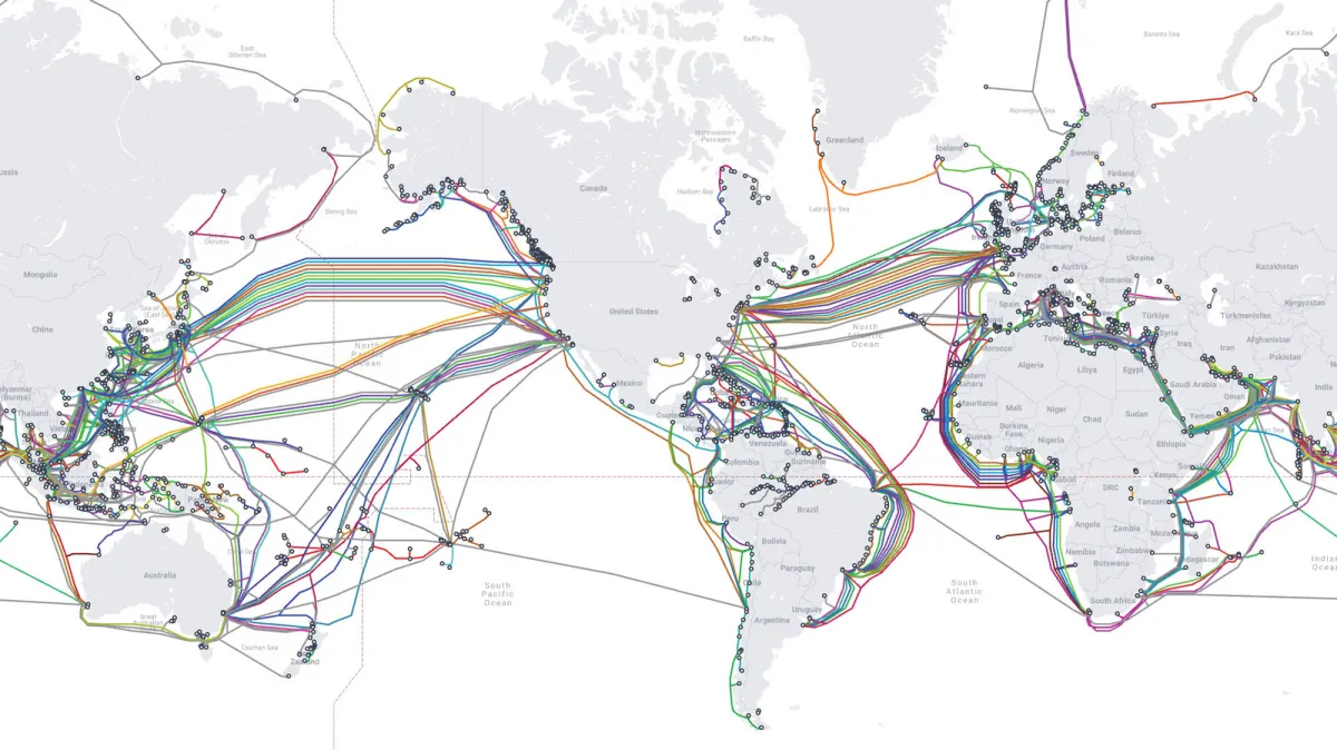 Submerged fiber optic cables resting on the ocean floor to transmit global internet data.