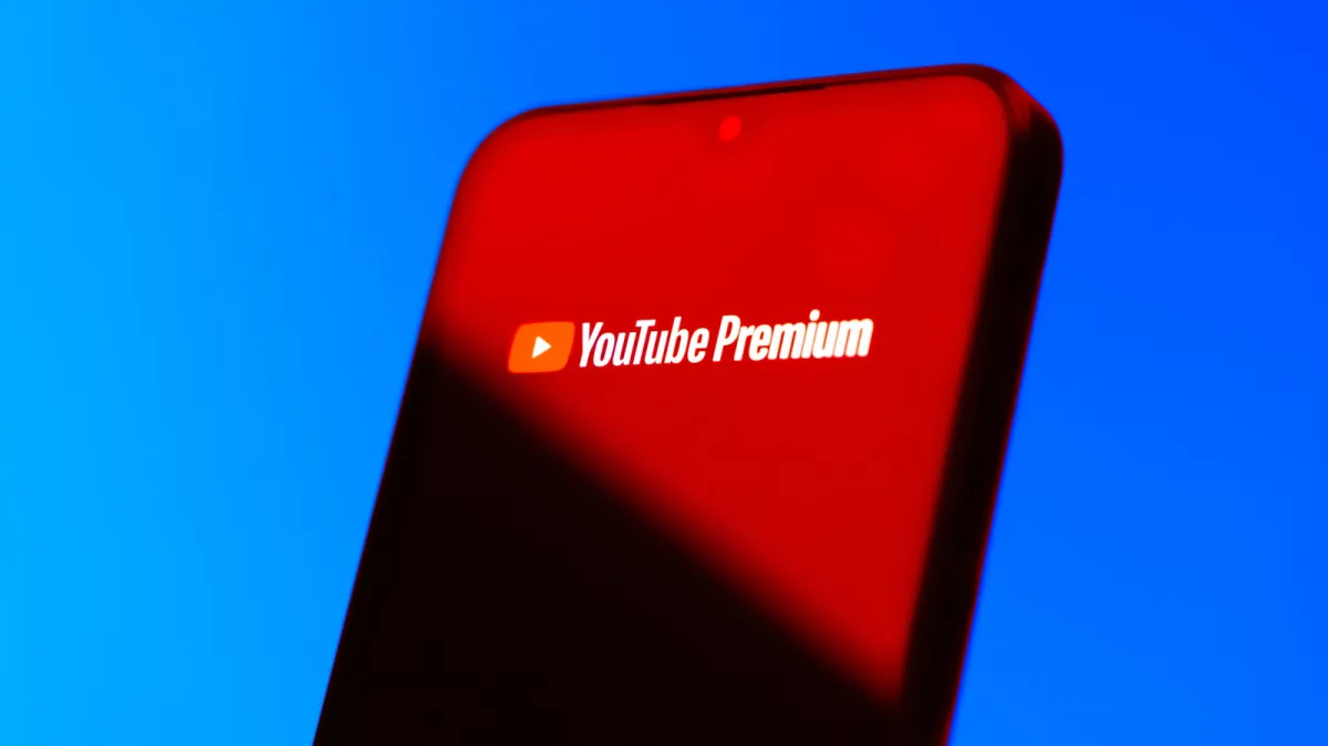 YouTube Premium subscription screen displaying ad-free viewing options and family plan details.