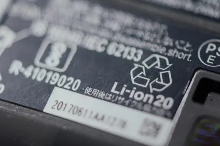 A lithium-ion battery is placed in a chemical bath to restore its capacity during recycling.