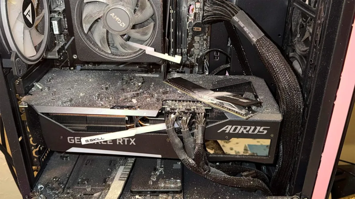 The damaged desktop computer tower displays a visible bullet hole after deflecting a stray projectile.