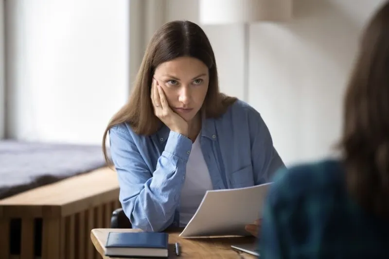 A person uses a laptop to access a UK government trial platform for an artificial intelligence resume assistant.