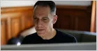 UC Berkeley professor Hany Farid sits at his desk while reviewing digital files for signs of AI manipulation.