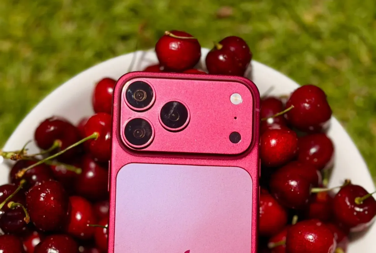 The iPhone 18 Pro Max displays a dark cherry finish on its rear casing.