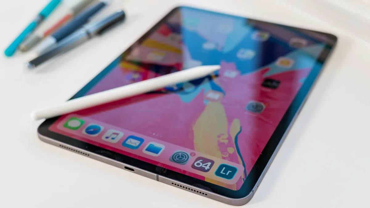 An iPad device displays the iPadOS interface to illustrate software update timelines.