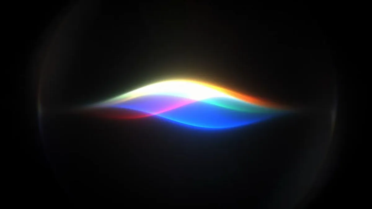 The Siri AI interface appears on an iPhone screen during the WWDC 2026 keynote presentation.