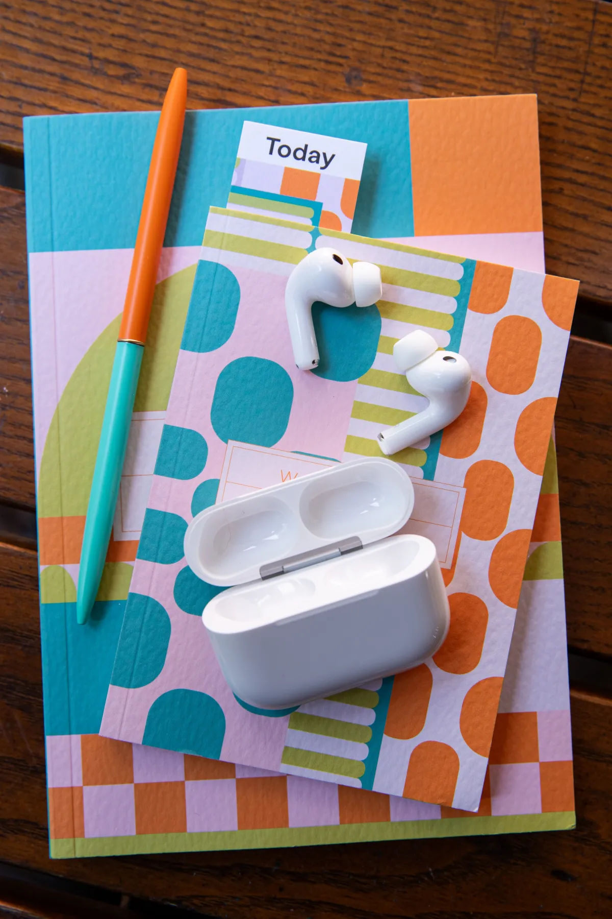 Apple AirPods Pro 3 wireless earbuds rest inside their charging case.