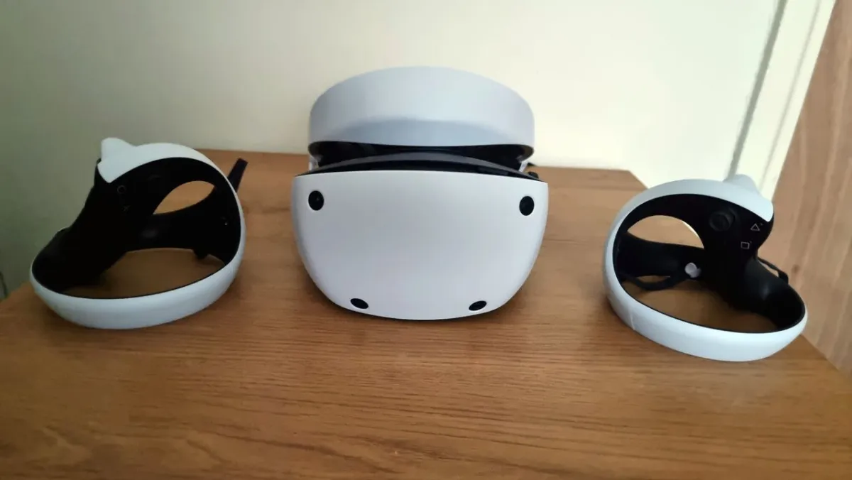 The PlayStation VR2 headset rests on a neutral display stand.