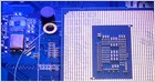 A stock market chart shows sharp declines in Nvidia, Micron, AMD, and Broadcom shares following Broadcom earnings miss.