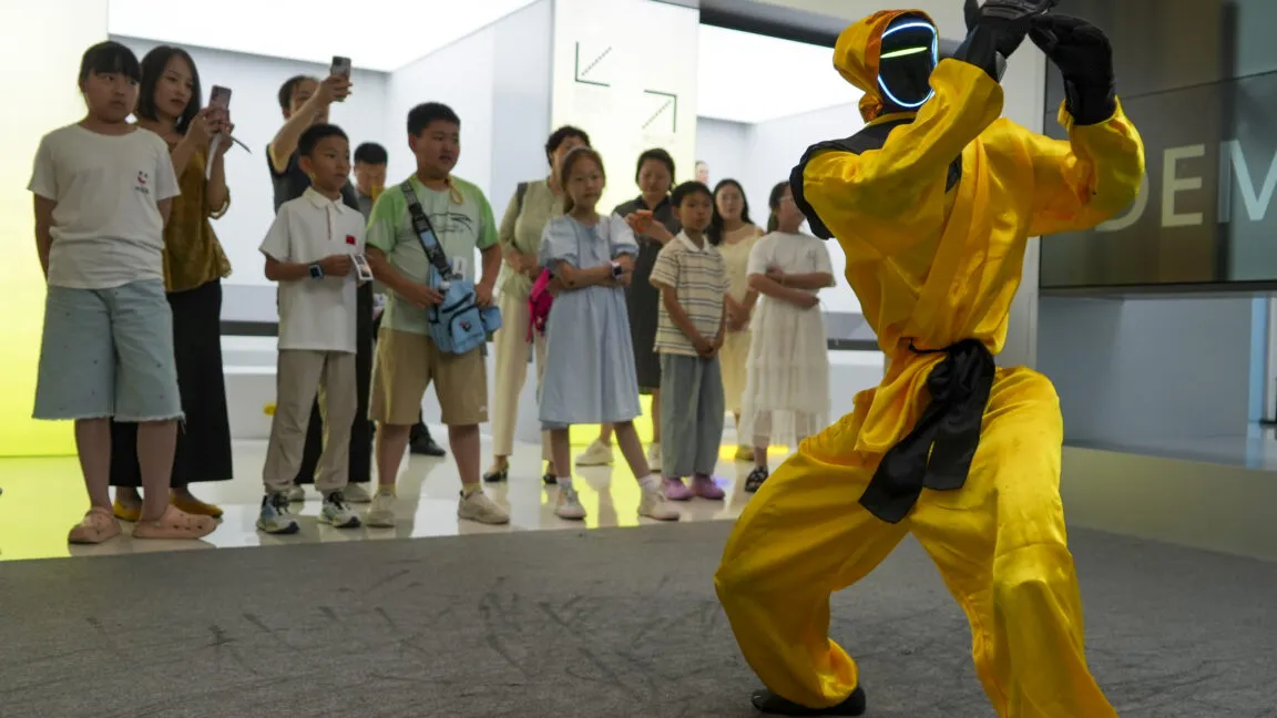 A humanoid robot demonstrates basic movements in a controlled testing environment.