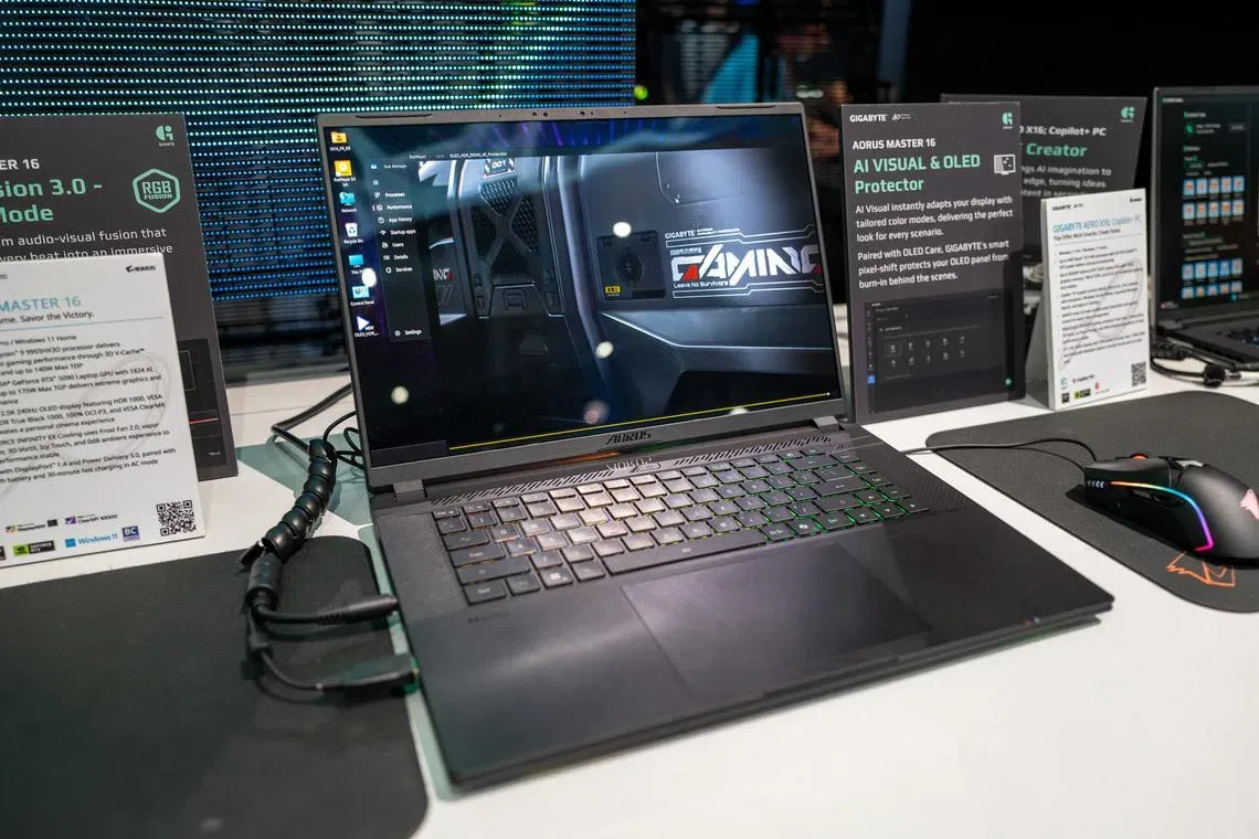 Gigabyte Aorus Master 16 laptop features a Ryzen 9 9955HX3D processor and an RTX 5090 graphics card in a slim chassis.