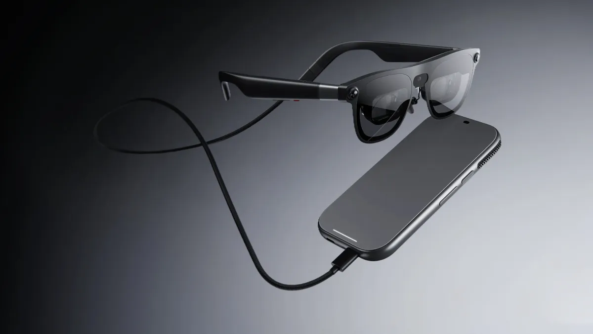 XREAL Aura XR glasses with Snapdragon Reality Elite chipset, featuring an optical see-through display and 3D hand tracking.
