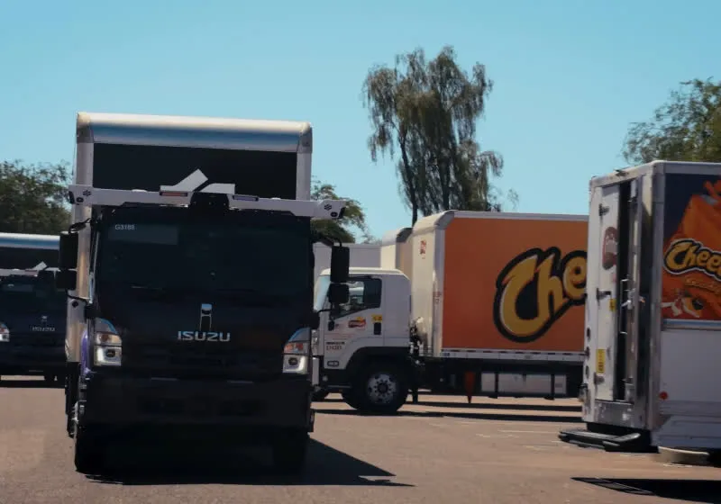 A driverless delivery truck travels on a highway as PepsiCo expands its commercial fleet across three states.