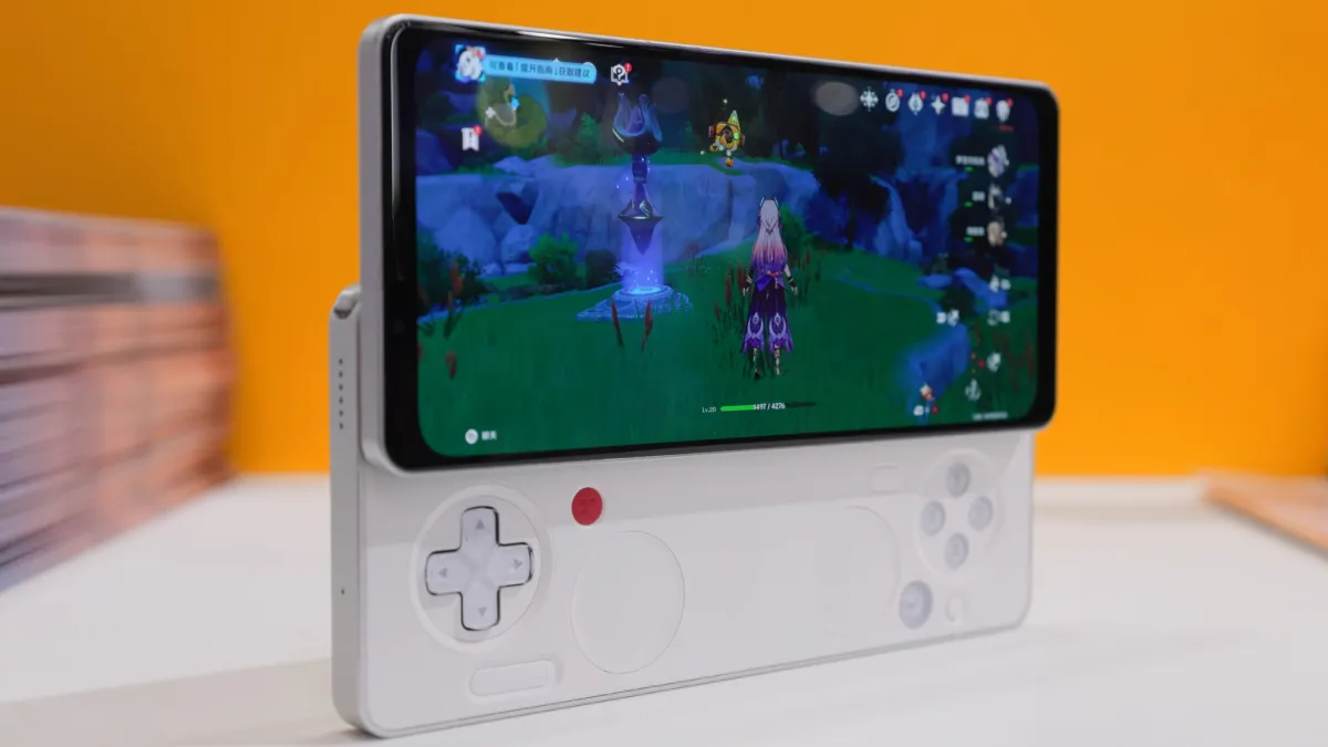 The Ayaneo Pocket Play handheld gaming device features a sliding OLED display and physical controls.