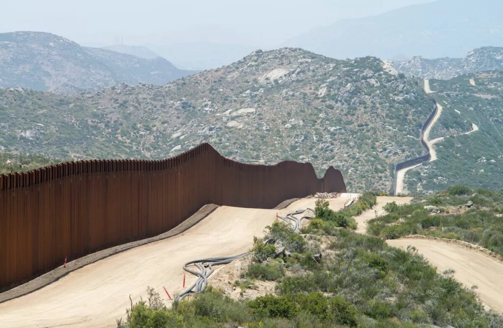 Southern border wall construction and electronic surveillance systems planned for completion by late 2027.