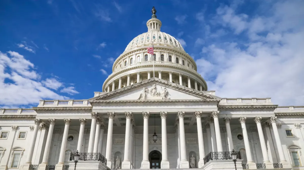 United States Capitol building exterior with American flag